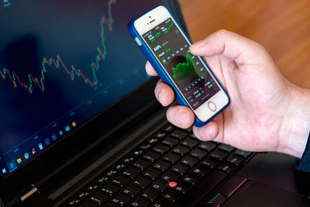 Hands of Investor analyzing stock market investments with financial dashboard, and key performance...