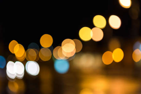 Blurred Night city street colorful lights bokeh dark night backgroundの写真素材