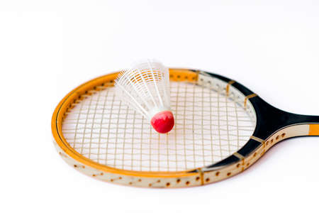 Closeup Badminton racket and shuttlecock isolated on whiteの写真素材