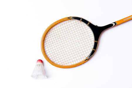 Closeup Badminton racket and shuttlecock isolated on whiteの写真素材