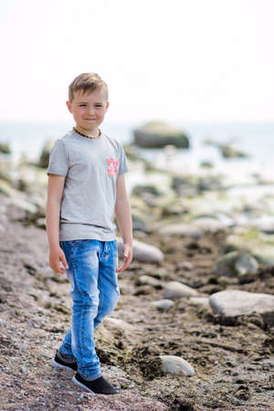 Calm nice boy kid on a sea Summer concept.の写真素材