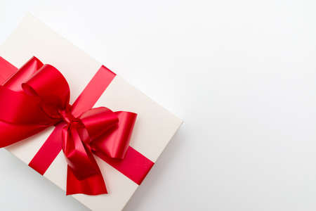 Top view Cristmas white gift box present red bow white studio background.の写真素材