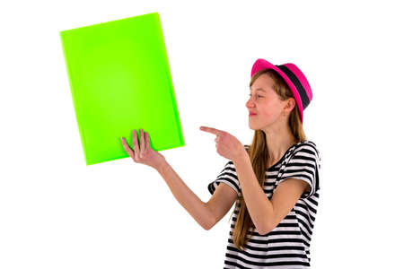 Happy girl child poke at empty blank paper isolated on white background.copy space banner advertisement closeup imageの写真素材