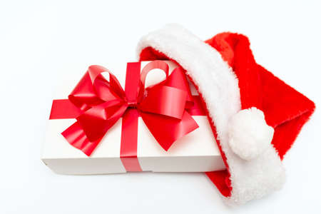 Christmas present with santa hat close up flat layの写真素材