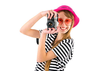 Traveler tourist teenage girl holding retro camera, globe isolated on white background.の写真素材