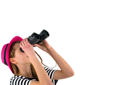 teenage girl looking to copy space with binoculars isolated on white background.travel on weekends...