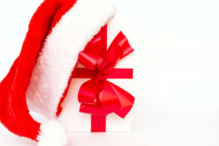 Christmas present with santa hat close up flat layの写真素材