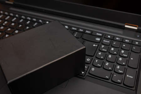 Black Friday sale online shopping commerce,gift box present on a keyboard, studio shot.の写真素材