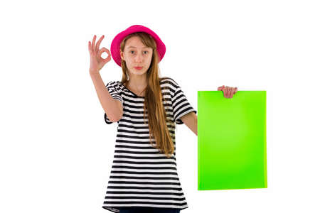 Happy girl child showing ok empty blank paper isolated on white background.copy space banner advertisementの写真素材