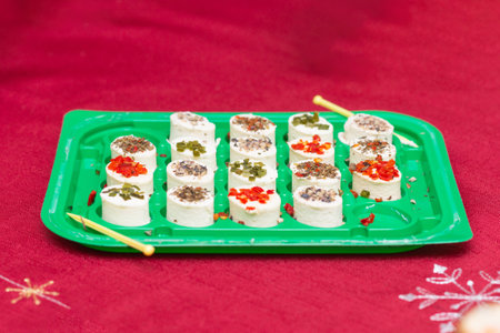 Cottage oval cheese with spices on a white plateの写真素材
