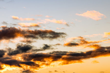 Dramatic clouds at sunset. clouds sunset at evening winter.the sun is hiding in the sky.の写真素材