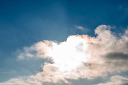 Sunset blue sky, bright sun shines through clouds.Nice sunset evening background.の写真素材