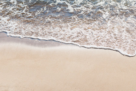 Soft wave of the sea on the sandy beach.Soft focus,blurred image.Copy space.
