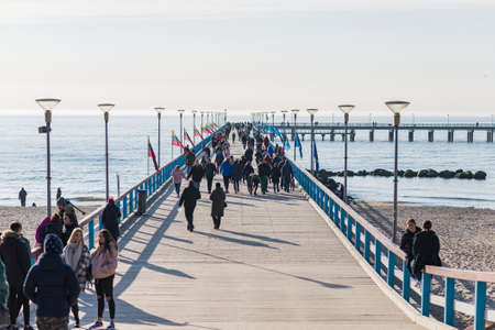 Sunset in Palanga, Lithuania View from pier. Pedestrian bridge at the Baltic sea in Palanga.Lithuania,Palanga 28 03 2021.のeditorial素材
