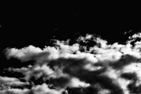 Dramatic white clouds black dark sky background outdoors shot.Beautiful wallpaper.の写真素材