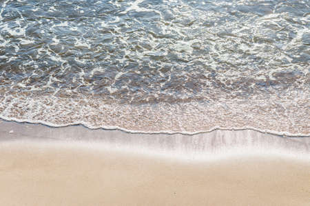 Soft wave of the sea on the sandy beach.Soft focus,blurred image.Copy space.