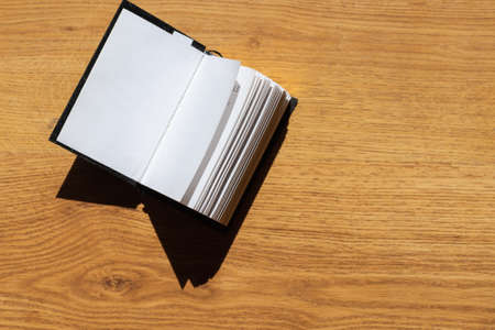 Open Holy Bible on a brown wooden table.Open Holy Bible top view.Religious concept.の写真素材