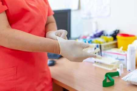 doc ready with gloves in the laboratory clinic hospital virology examination to prepare analysis...