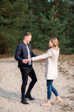 Happy loving couple enjoying in moments of happiness in the park. Love tenderness,dating, romance. Lifestyle concept.Young couple lover dating and hugging in love at spring park.Romantic love conceptの写真素材