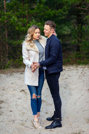 Happy loving couple enjoying in moments of happiness in the park. Love tenderness,dating, romance. Lifestyle concept.Young couple lover dating and hugging in love at autumn park.Romantic love conceptの写真素材