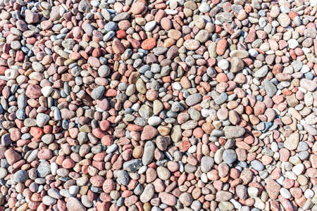 Natural colorful pebble background texture with copy space.Sea stone,Sea stones top view. Background...