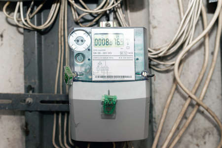 Modern electric meter close up view.Electric power meter measuring power usage. One Watt hour electric meter measurement tool,front view.Copy space.の写真素材