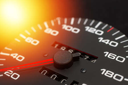 Speedometer in a car. Car dashboard. Dashboard details with indication lamps.Car instrument panel. Dashboard with speedometer, tachometer, odometer. Car detailing. Modern interior.Closeup shot.の写真素材