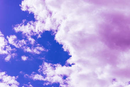 Purple clouds with beautiful blue sky,on the heaven.Amazing nature background.Toned.の写真素材
