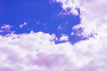 Purple clouds with beautiful blue sky,on the heaven.Amazing nature background.Toned.の写真素材