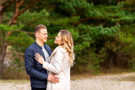 Happy loving couple enjoying in moments of happiness in the park. Love tenderness,dating, romance. Lifestyle concept.Young couple lover dating and hugging in love at spring park.Romantic love conceptの写真素材