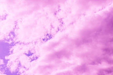 Beautiful dramatic pink cloud purple sky and violet filter Background.Toned.の写真素材