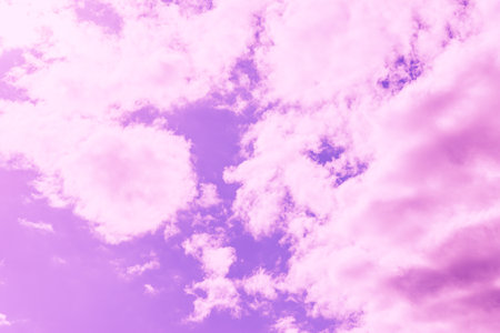 Beautiful dramatic pink cloud purple sky and violet filter Background.Toned.の写真素材