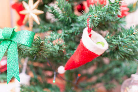Christmas tree and Christmas decorations.Decorated Christmas tree closeup.balls,toys and illuminated garland with flashlights. New Year baubles closeup photo with bokeh.の写真素材