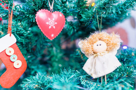 Christmas tree and Christmas decorations.Decorated Christmas tree closeup.balls,toys and illuminated garland with flashlights. New Year baubles closeup photo with bokeh.の写真素材