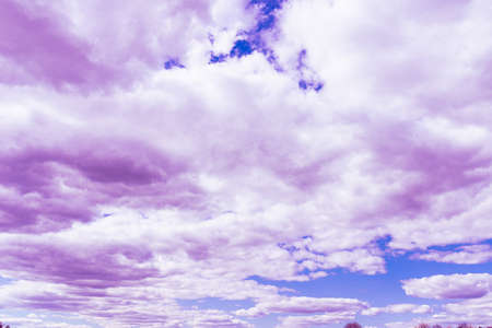 Purple clouds with beautiful blue sky,on the heaven.Amazing nature background.Toned.の写真素材