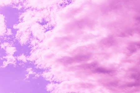 Beautiful dramatic pink cloud purple sky and violet filter Background.Toned.の写真素材