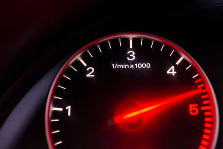 Dashboard with speedometer, tachometer, odometer. Car detailing. Car dashboard. Dashboard details with indication lamps.Car instrument panel.Modern interior.Close up shot.Blurred image.の写真素材