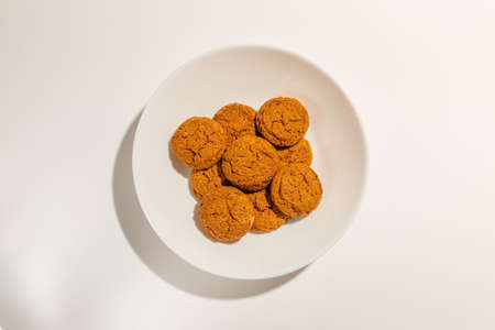 Cookies,Biscuits on white plate top view on white background.の写真素材