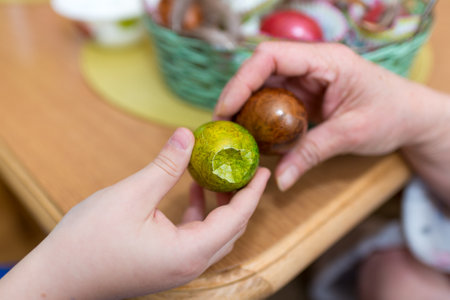 People knocking eggs on Easter day close up.Easter concept.の写真素材