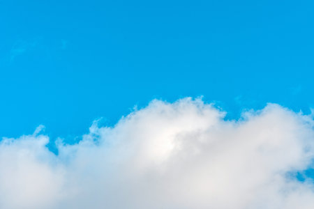 Nice cloudscape white fluffy clouds in the blue sky.Blue sky background with cloudsの写真素材