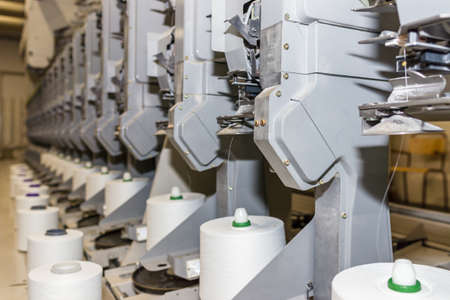 White textile yarn warping machine. machinery and equipment in the textile factory.Soft focus.の写真素材
