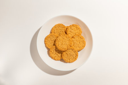 Cookies,Biscuits on white plate top view on white background.の写真素材