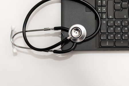 Stethoscope and computer with copy space for text.White background.Closeup.