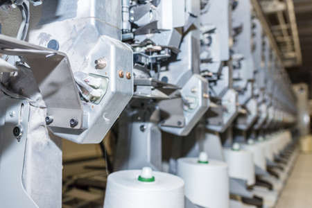 White textile yarn warping machine. machinery and equipment in the textile factory.Soft focus.の写真素材