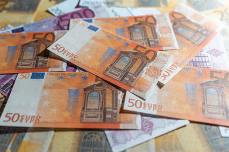 Pile of paper euro banknotes.Euro Money currency cash background.Top view.の写真素材