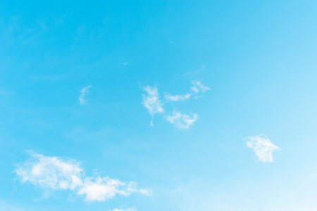Nice cloudscape white fluffy clouds in the blue sky.Blue sky background with cloudsの写真素材