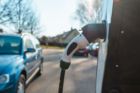 Close up power cord for electric car. Green station.Power supply for electric car battery...