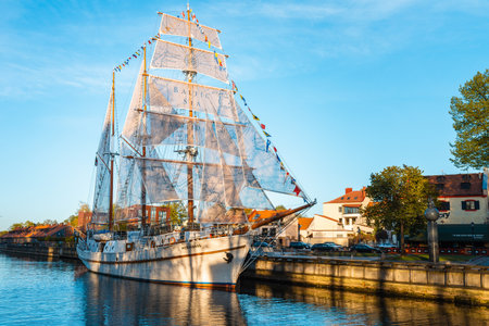 Beautiful old ship Meridian at sunset evening,blue calm sky,blue water.Symbol and landmark of Klaipeda city.Klaipeda, Lithuania - 05 May 2022.のeditorial素材
