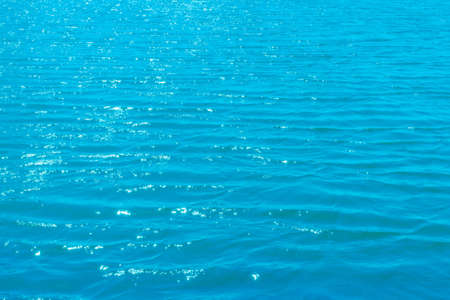 Abstract blue wavy calm water sea for background. Water texture.clear blue sea, water seascape abstract background.の写真素材