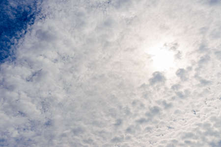 Summer blue sky white clouds light white background. Beauty clear cloudy in summer day bacground.landscape in environment day horizon skyline view spring windy day.の写真素材
